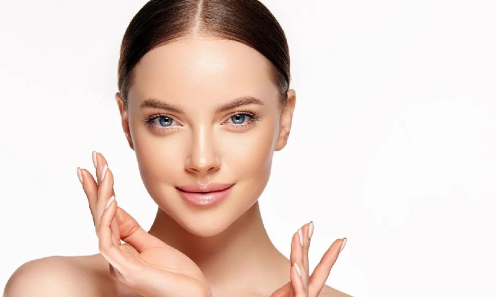 Woman showing smooth, defined jawline and glowing skin after Kybella in Riverside, CA