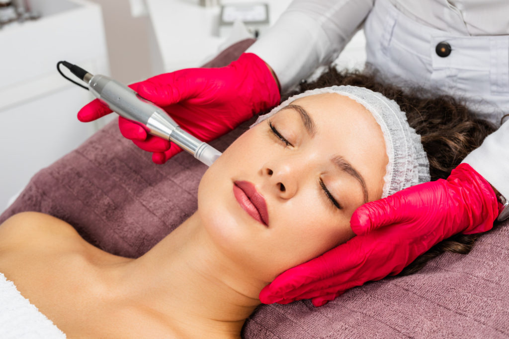 Beautiful woman receiving microneedling rejuvenation treatment. Mesotherapy in Magnolia-Medical-Aesthetics